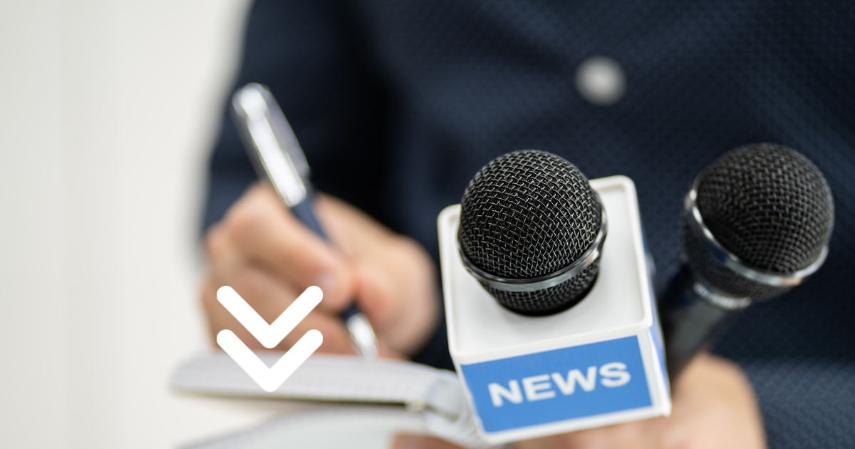 Reporter holding microphone and pen